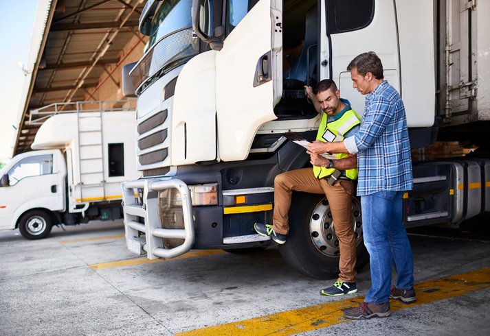 Safety professionals reviewing documentation - Regulatory Compliance Management